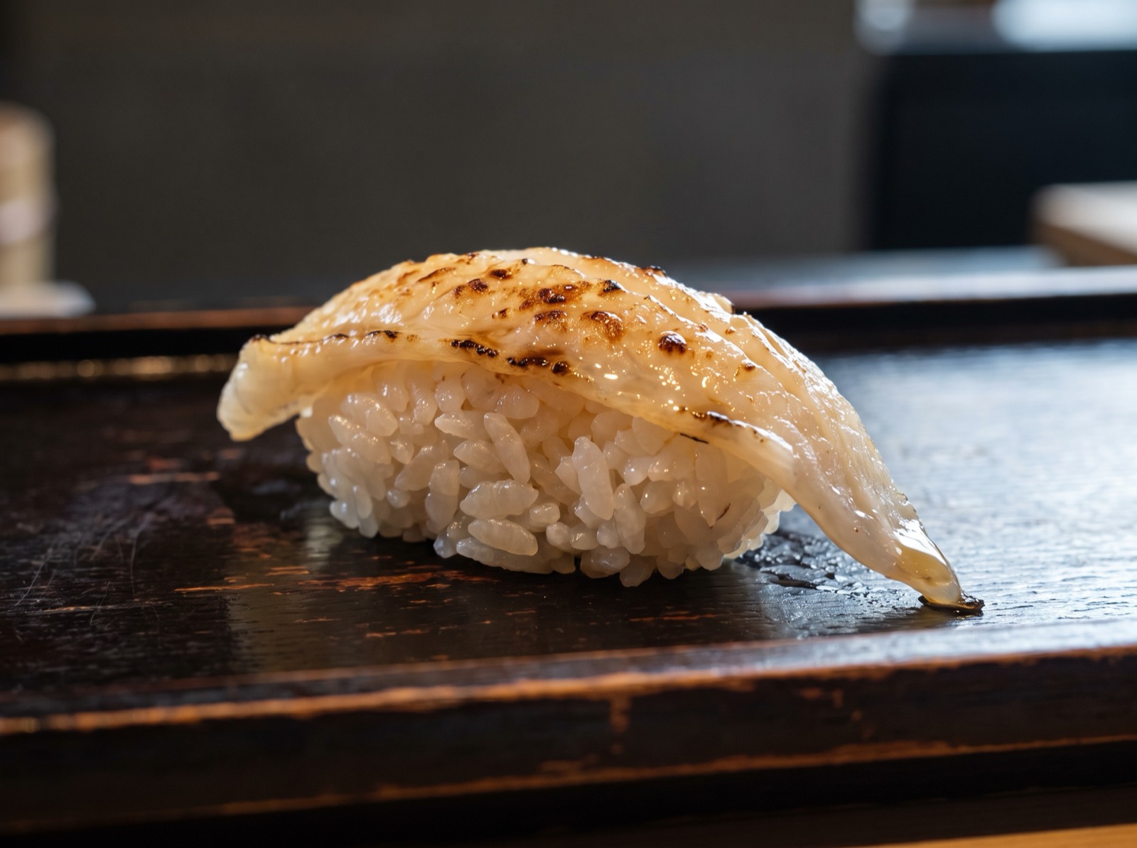 Engawa nigiri, lightly seared along the fin muscle.