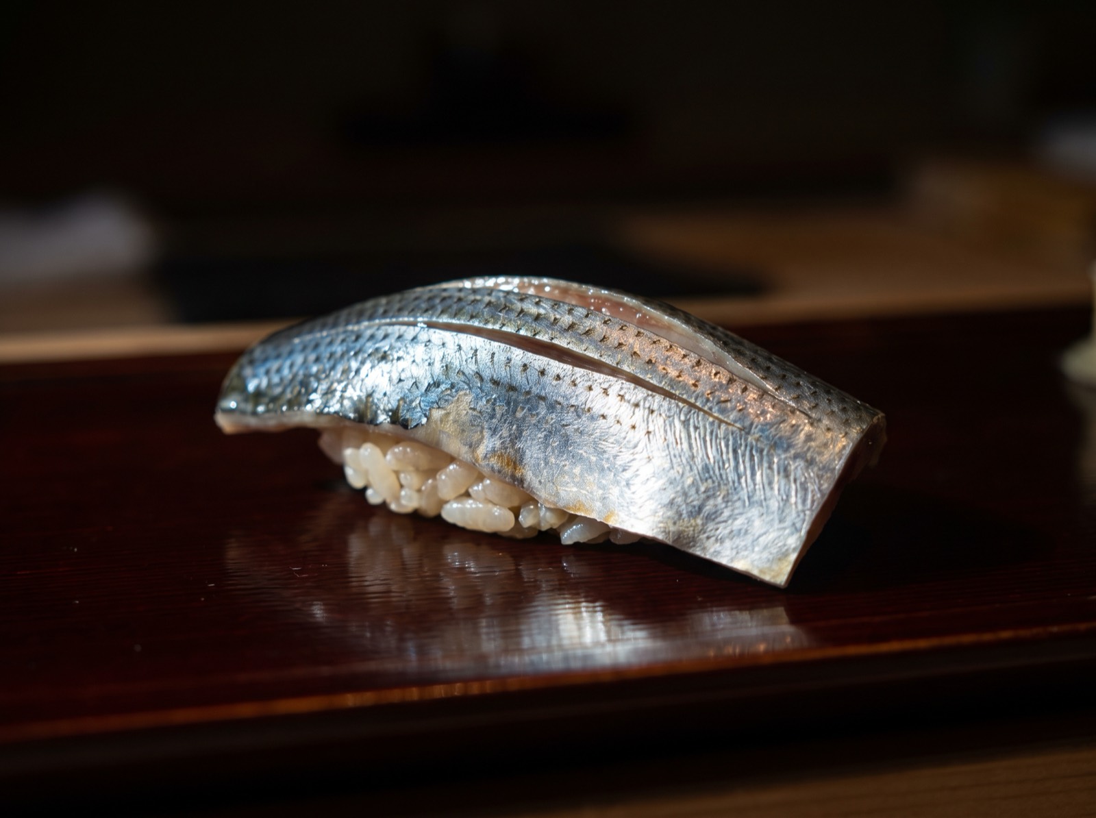 Hikarimono nigiri, cropped so close on the shine of the skin that the species cannot be told.