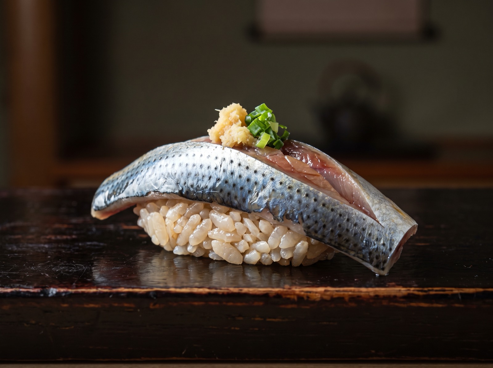 Sardine nigiri with grated ginger and spring onion.