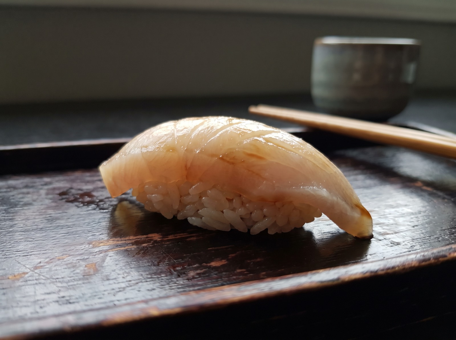 Kanpachi nigiri, cut thick and brushed with nikiri.