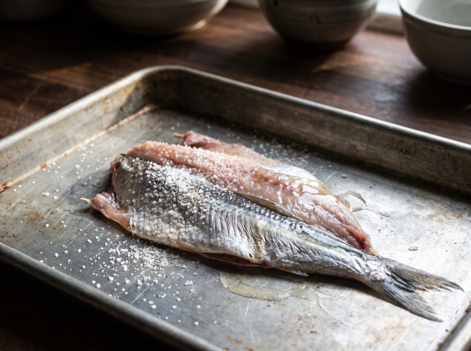 Kisu, a small butterflied fish midway through being salted and vinegared.