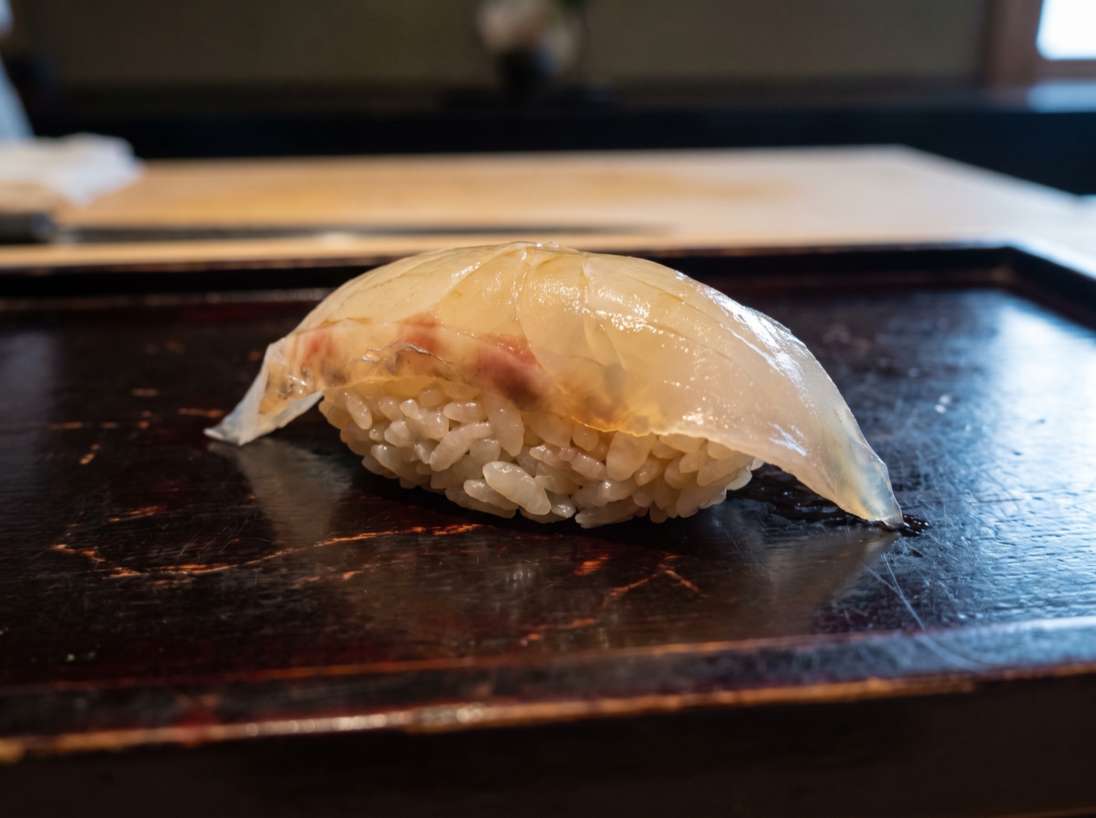 Sea bream nigiri, cut thin after curing in kombu.