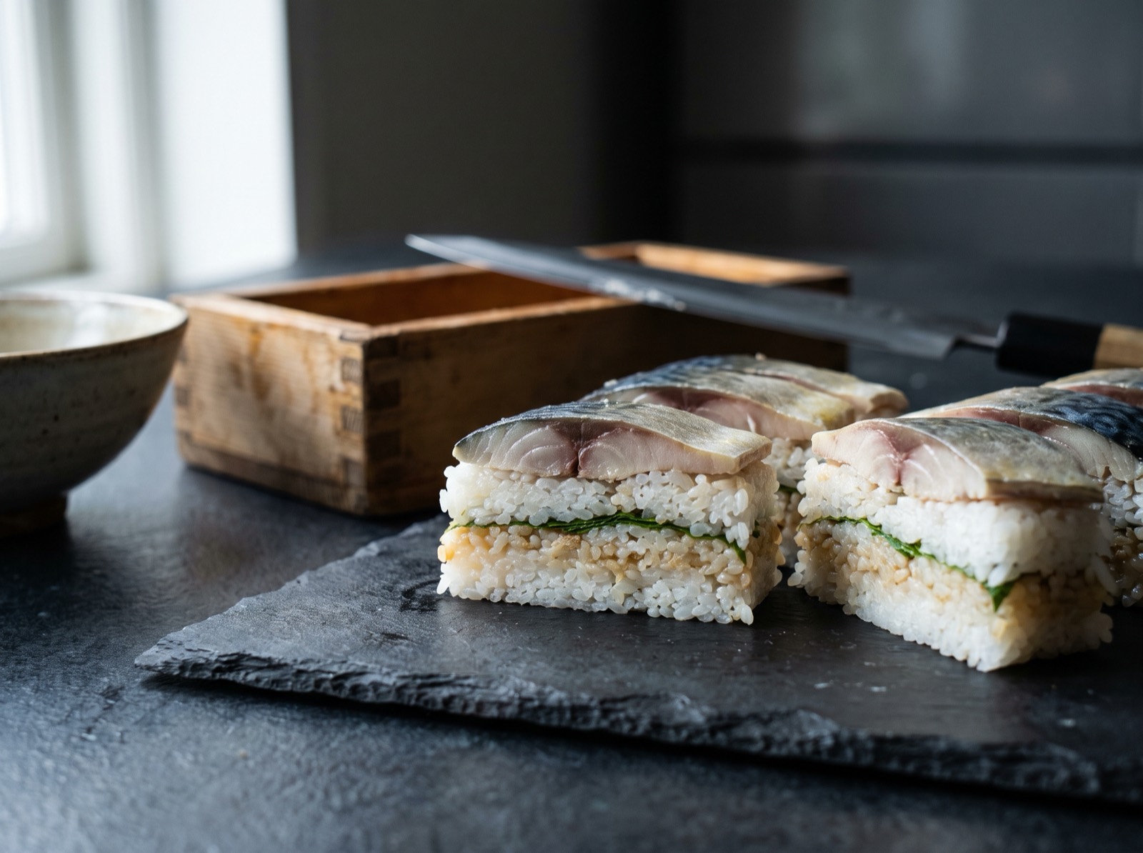Pressed sushi, cut into squares with sharp edges.