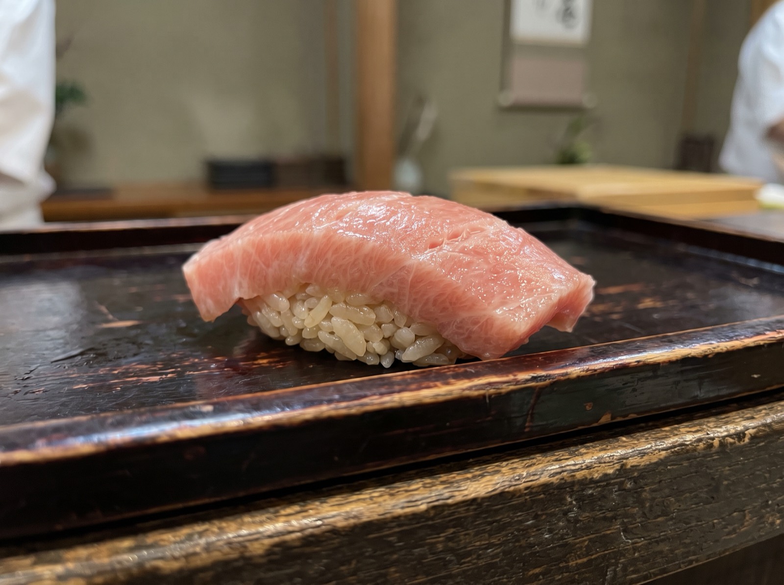 Otoro nigiri, marbled with broad bands of fat.