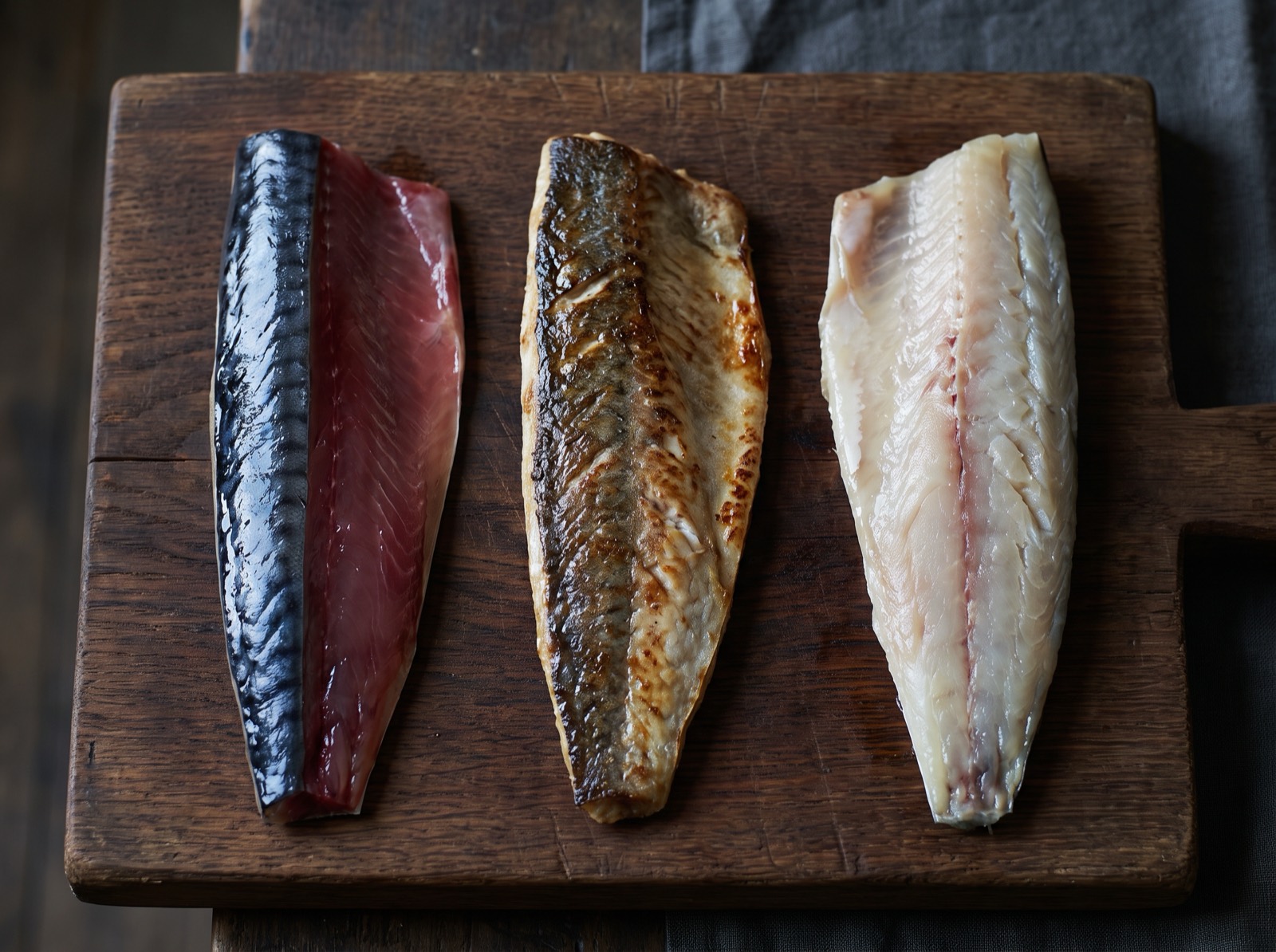 Sanma, three cuts of the same fish shown raw, seared, and vinegar-cured.