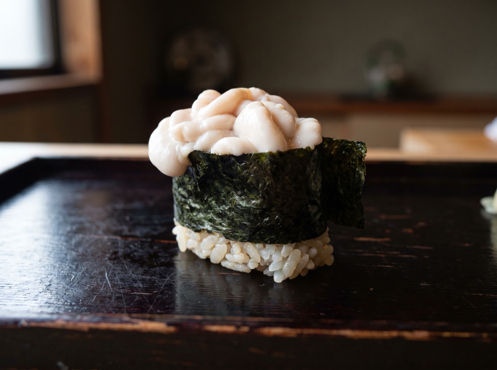 Shirako gunkan, a soft pale mass held together only by the band of nori.
