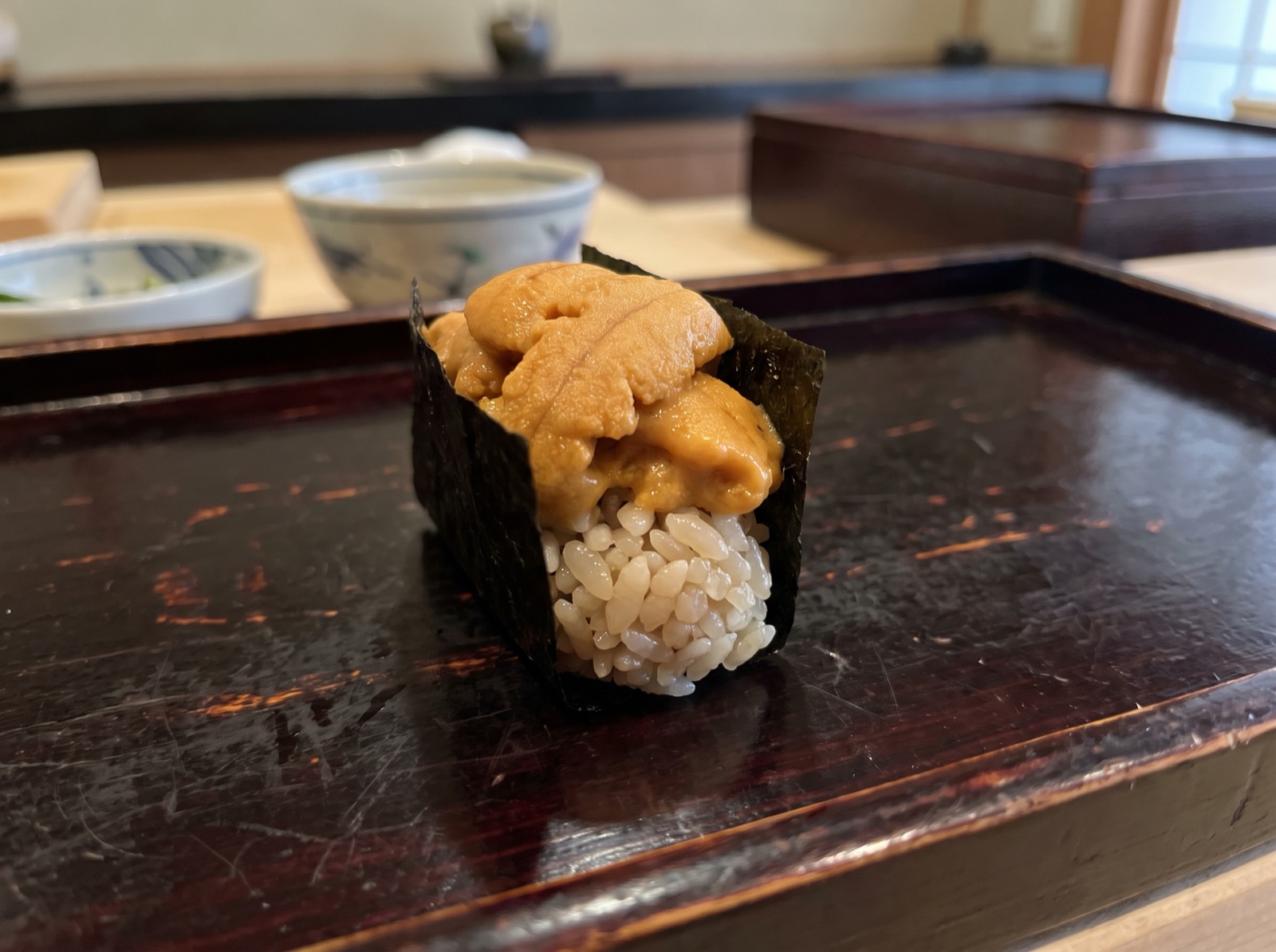 Uni gunkan, sea urchin held upright by a band of nori.