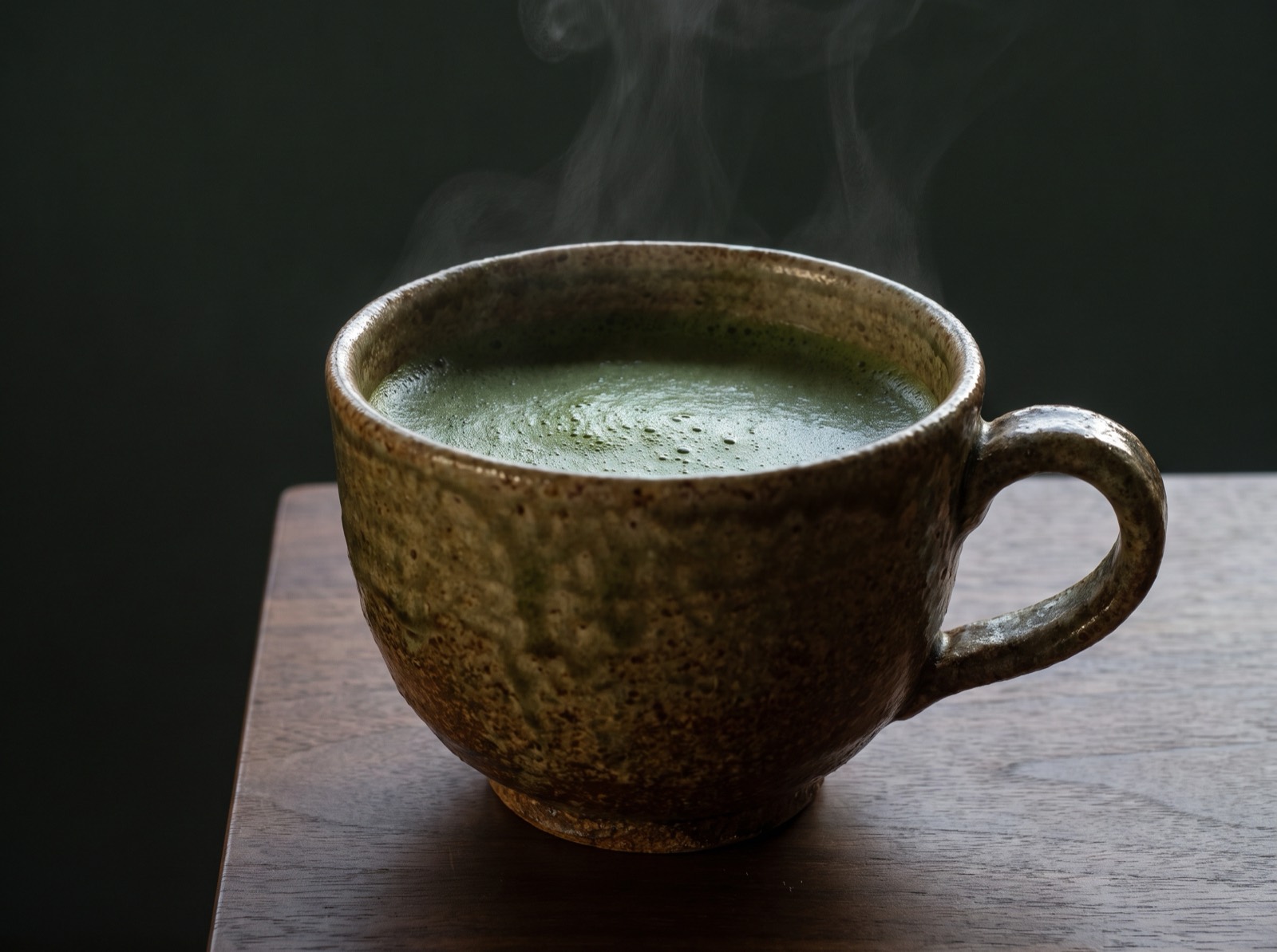 Powdered green tea in a large cup.