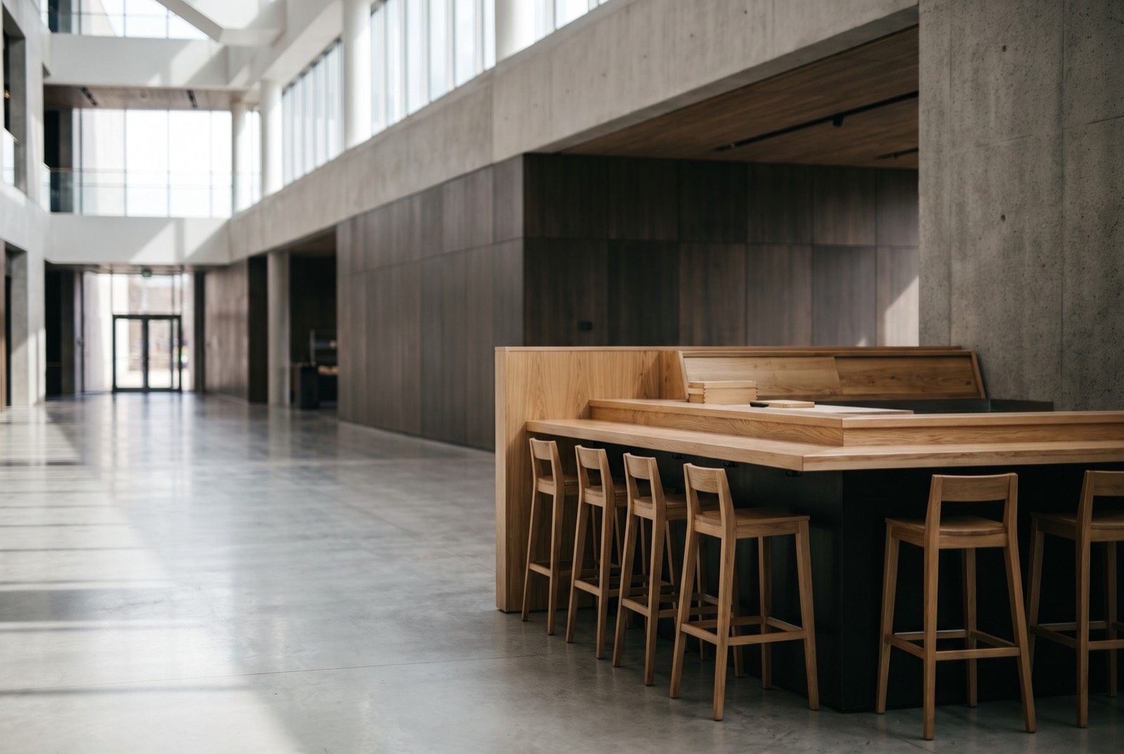 A counter set into the open floor of a large building.
