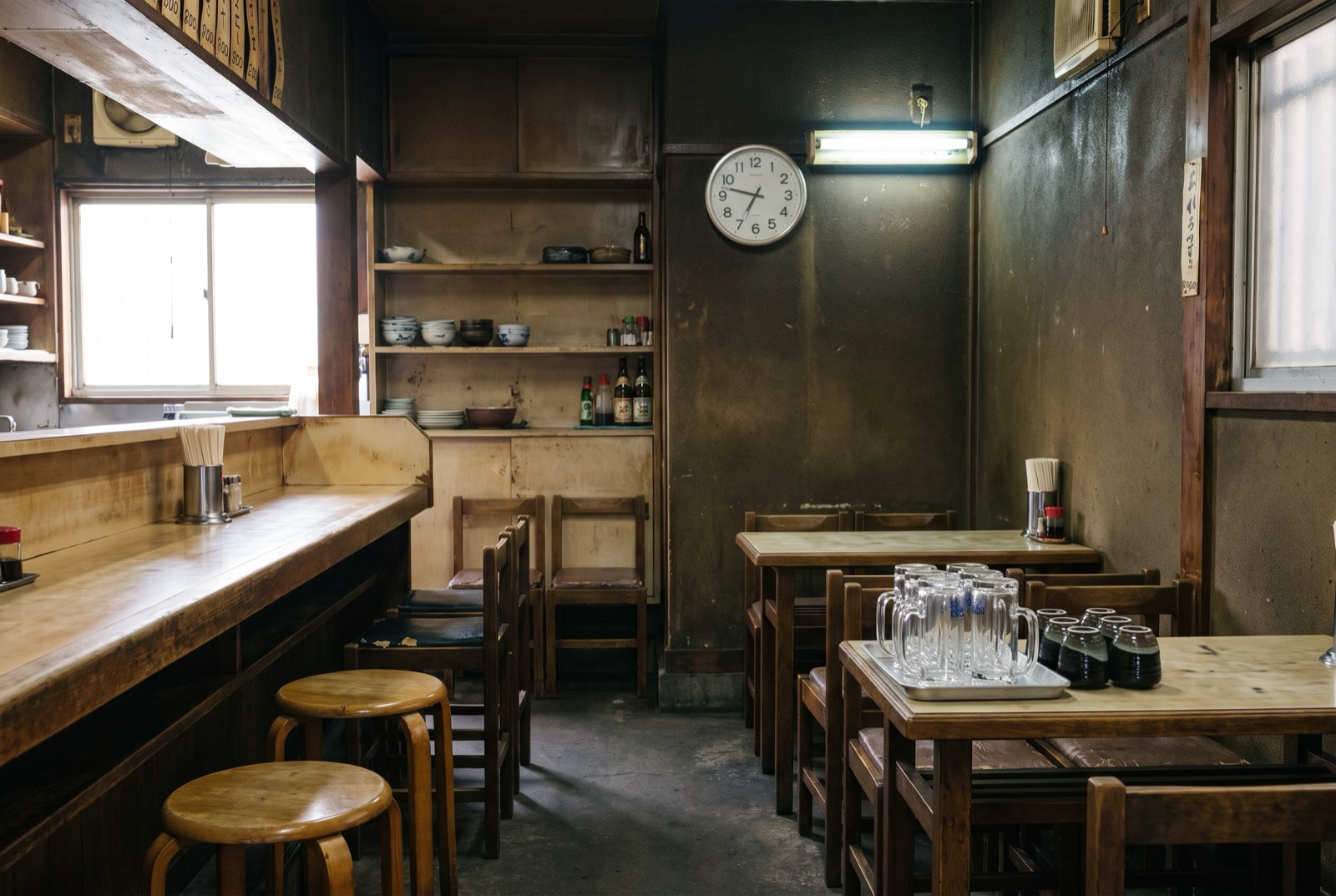 A neighbourhood shop where counter and tables share one room.